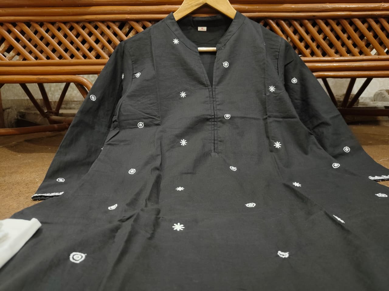 Folded black kurti and white palazzo set