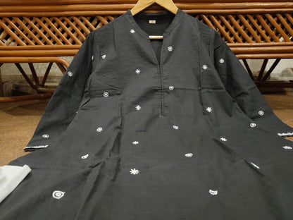 Folded black kurti and white palazzo set