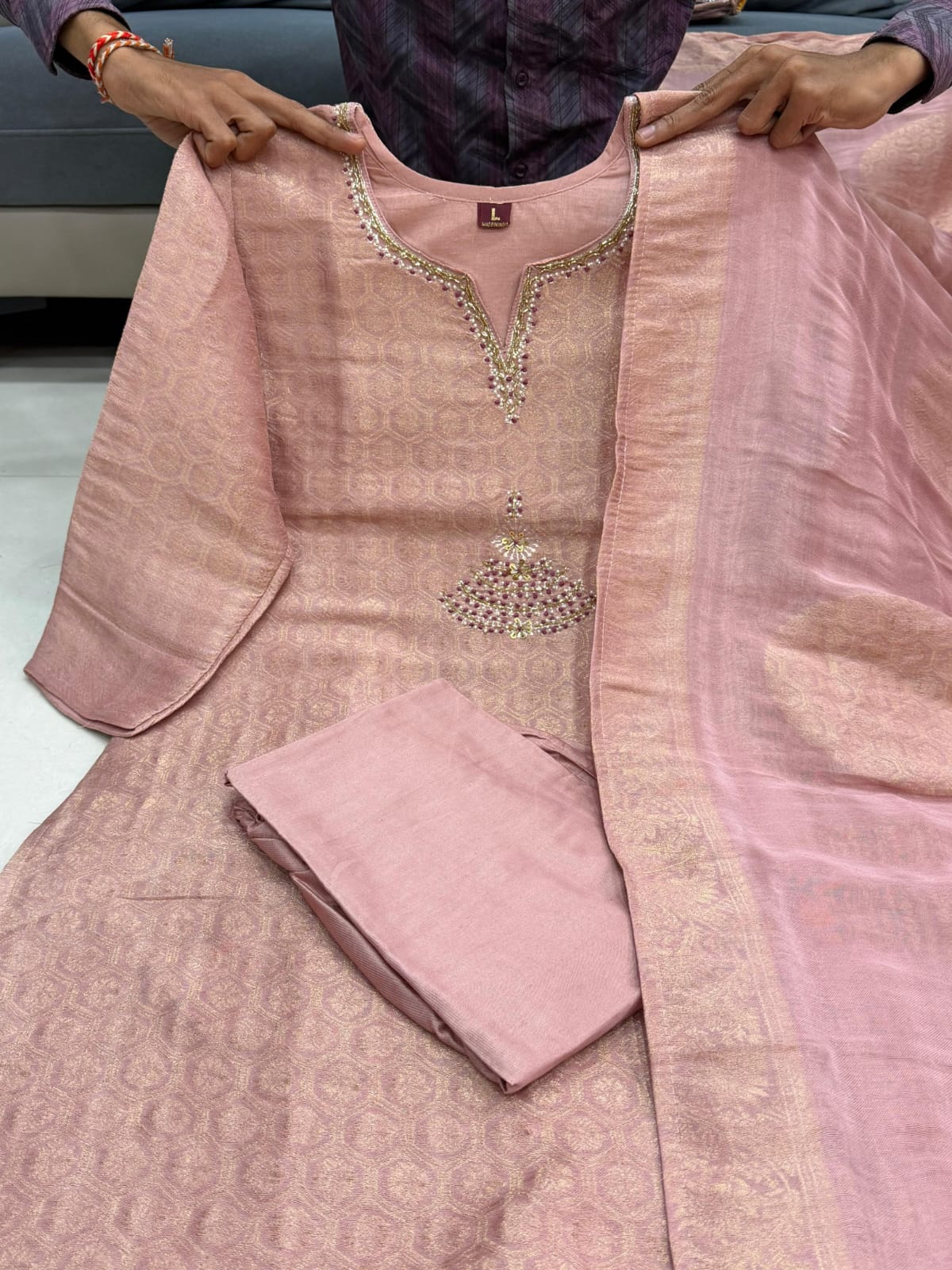 Kanjivaram Glass Tissue Suit Set - Model wearing beige suit front view