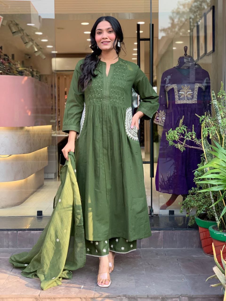 Green kurta set flat lay with pant and dupatta