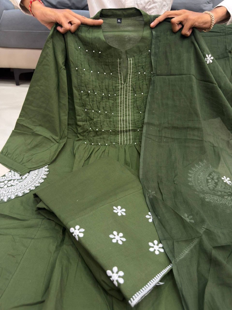 Close-up of neck embroidery and pintuck work