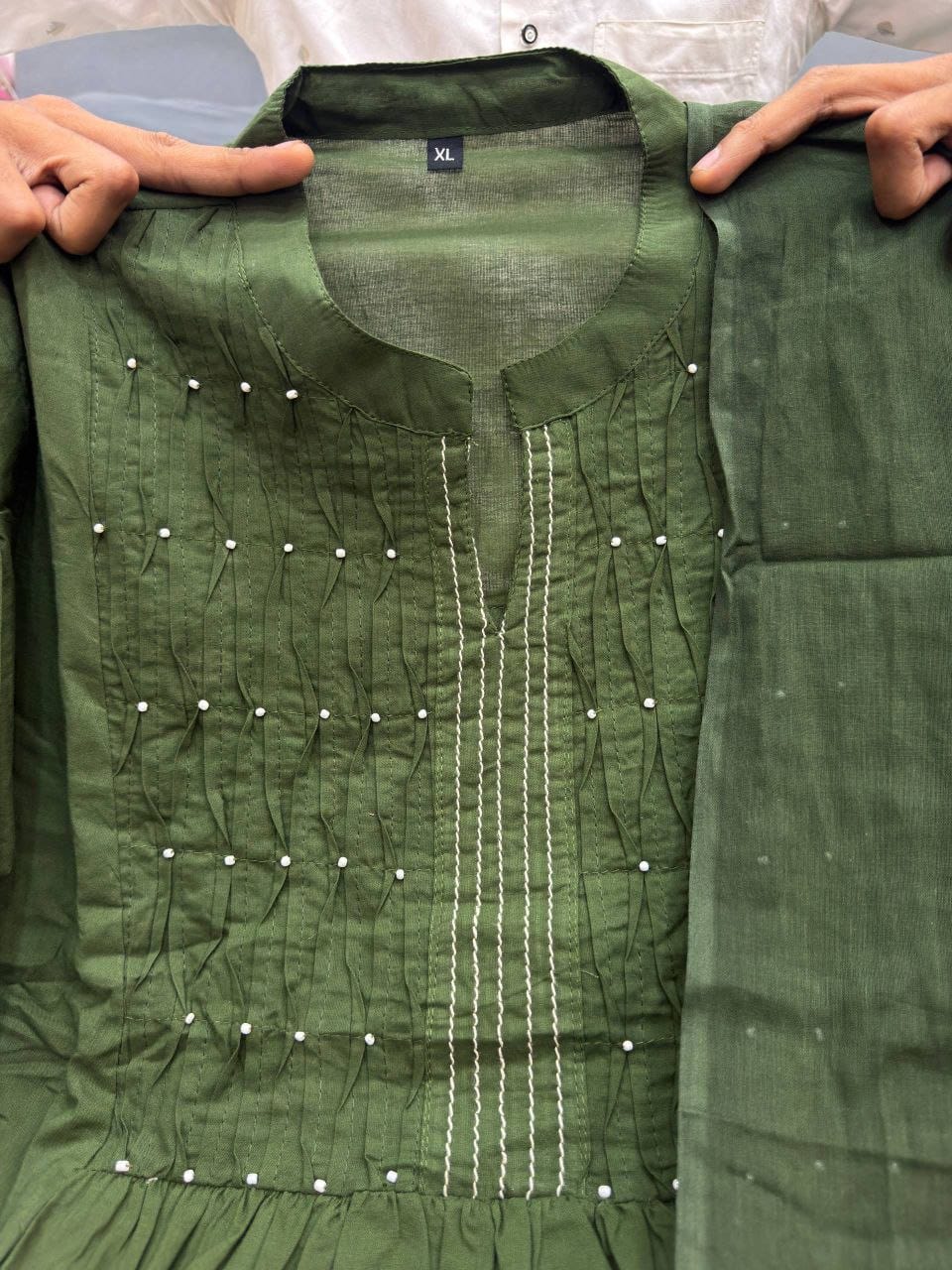 Close-up of yoke detailing and pearl buti work